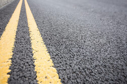 Yellow road marking on road surface
